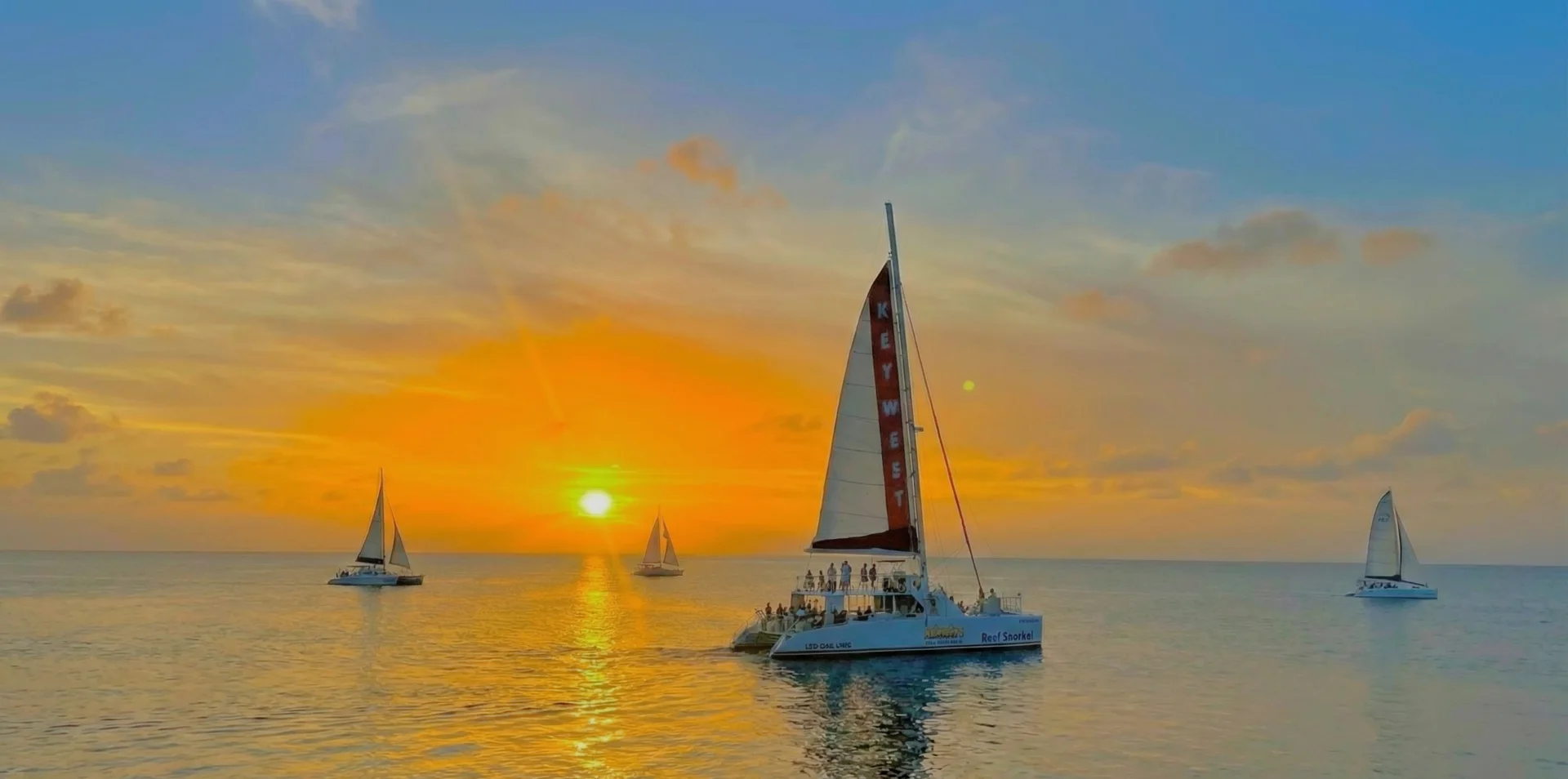 Guests enjoying a Key West sunset sail aboard the Sandie Cat